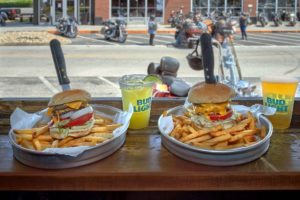 trays of burgers and fries at Iron Boar Saloon