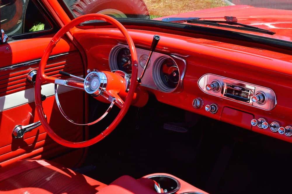 view from the passenger side looking at the red interior the car