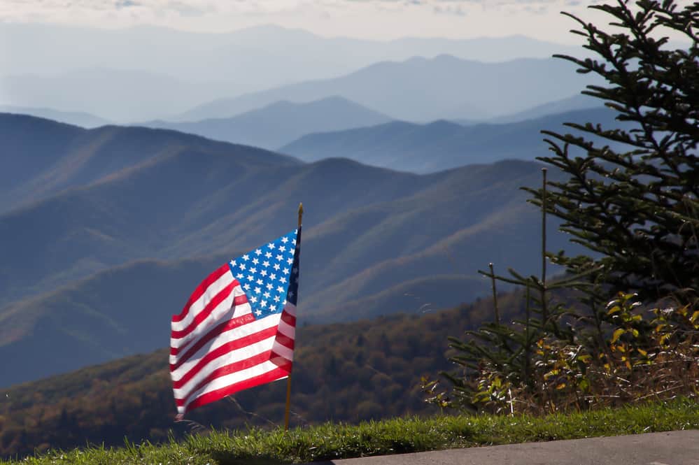 american flag in mountains