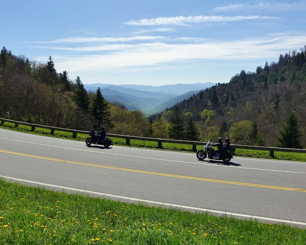 two motorcycles on mountain road